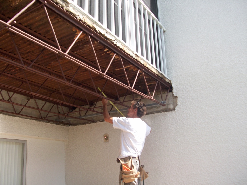 Man fixing balcony